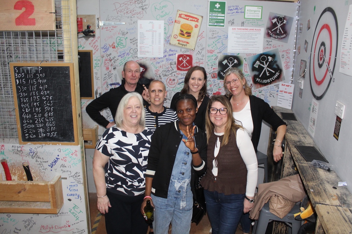 Group axe throwing session at Rage Out Maidstone — ThrowDown Pro live scoring on the wall